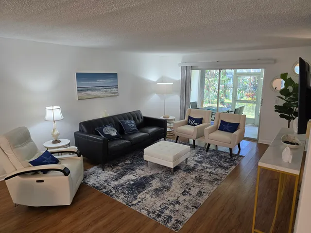 a living room with furniture or couch and a flat screen tv