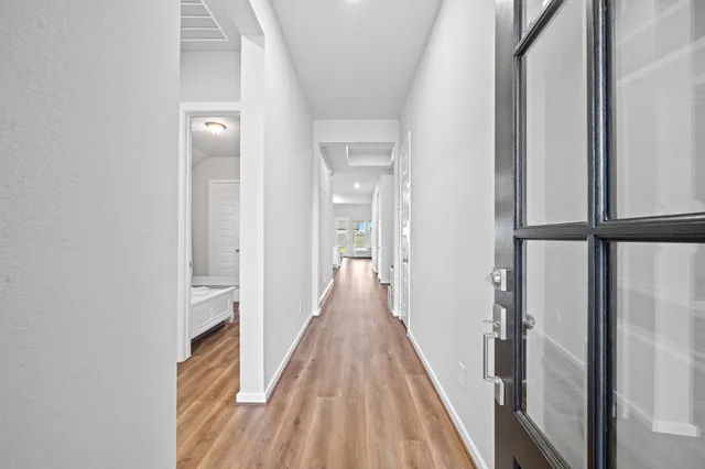 a bedroom with a bed and a view of bedroom