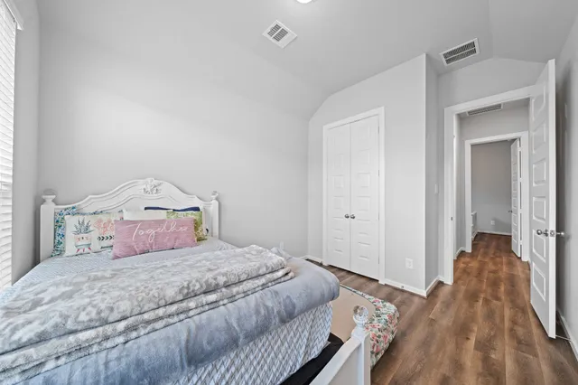 a bed room with a bed and a window