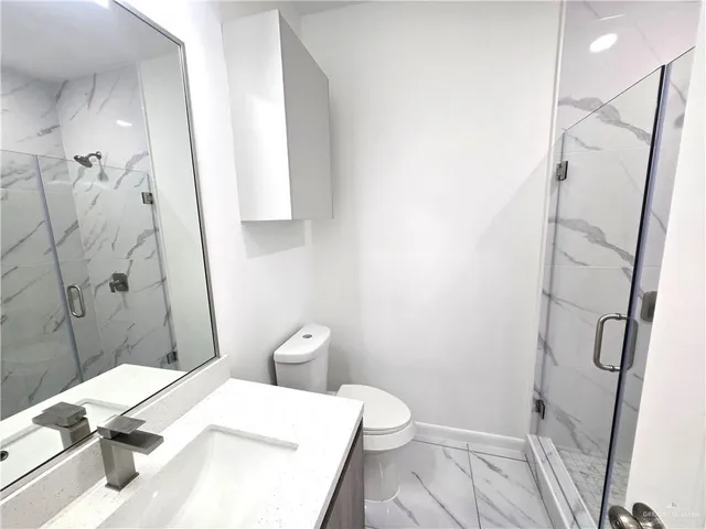 a bathroom with a sink and toilet