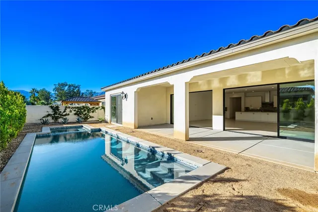 a view of a house with a swimming pool