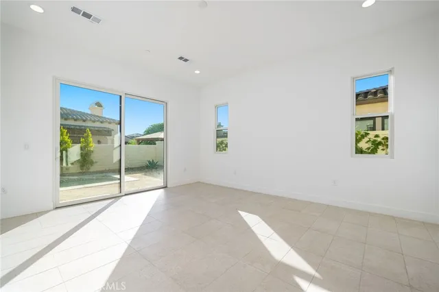 a bathroom with a white tub sink and mirror