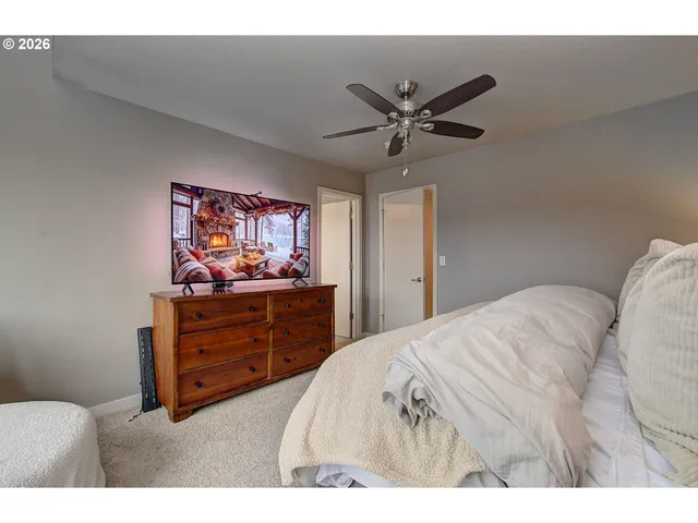 a bed room with a bed and a television