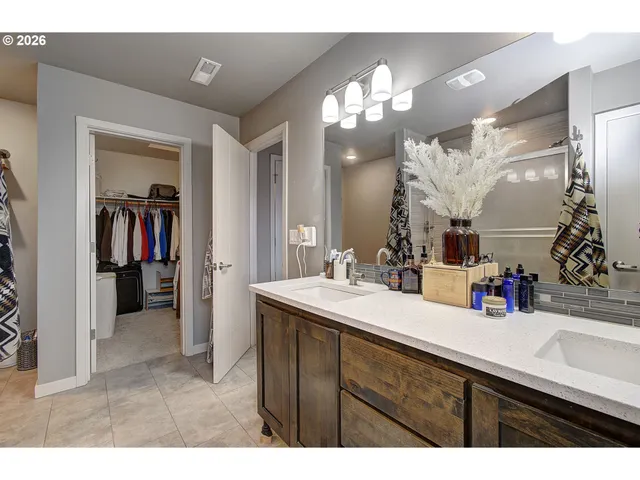 a bathroom with a sink vanity and a mirror