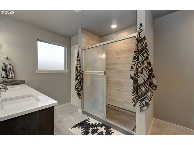 a bathroom with a bathtub and a sink