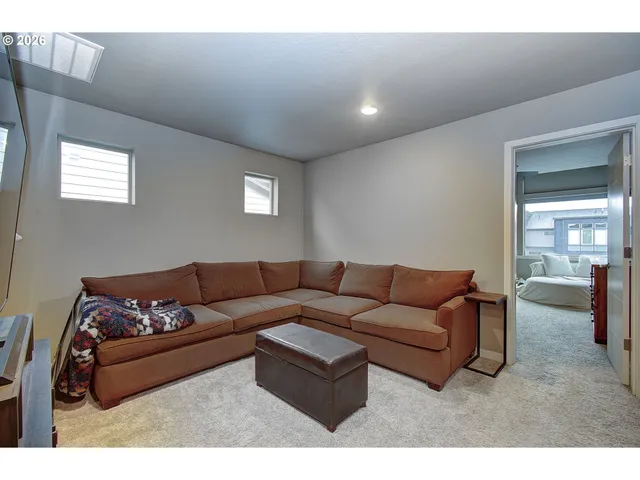 a backyard of a house with barbeque oven table and chairs