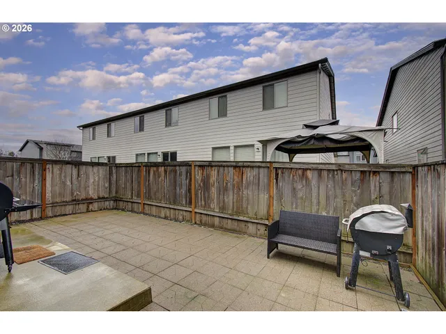 a view of a white house with wooden floor