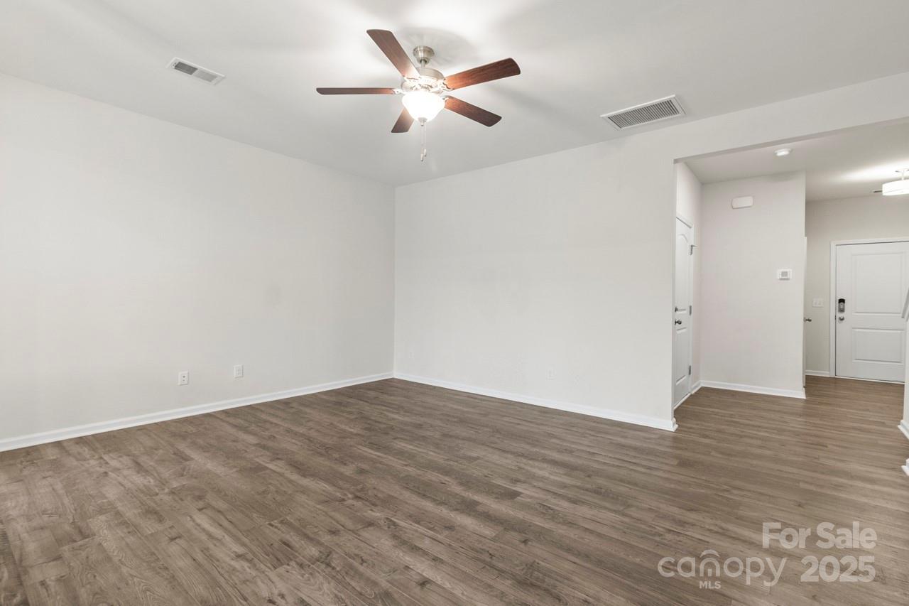 3776 Yorkshire Place Terrell, NC 28682 - Photo 19 of 47 an empty room with wooden floor and a ceiling fan