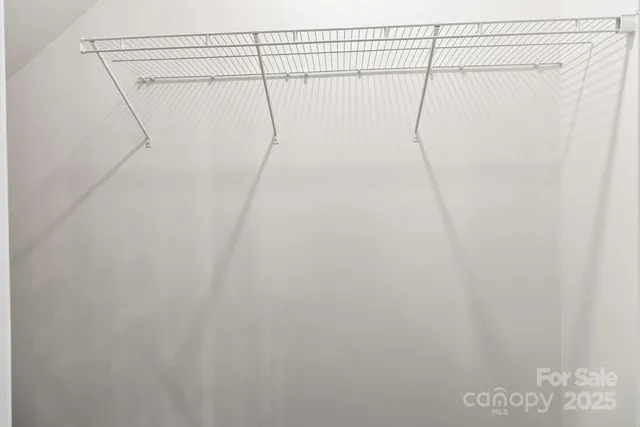 a bathroom with a granite countertop sink toilet a large mirror a bathtub and shower