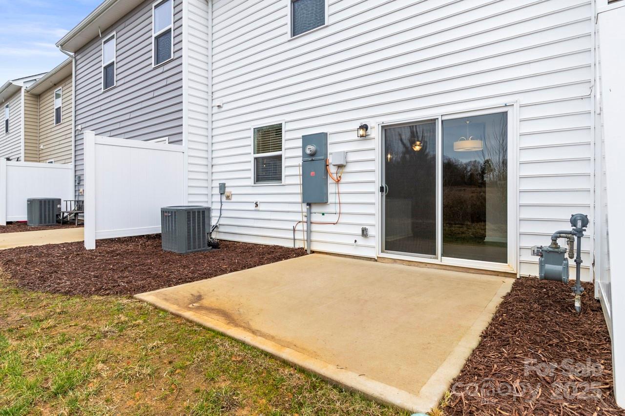 3776 Yorkshire Place Terrell, NC 28682 - Photo 4 of 47 a view of a white house with many windows