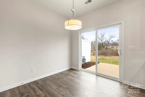 a view of kitchen with granite countertop cabinets and stainless steel appliances