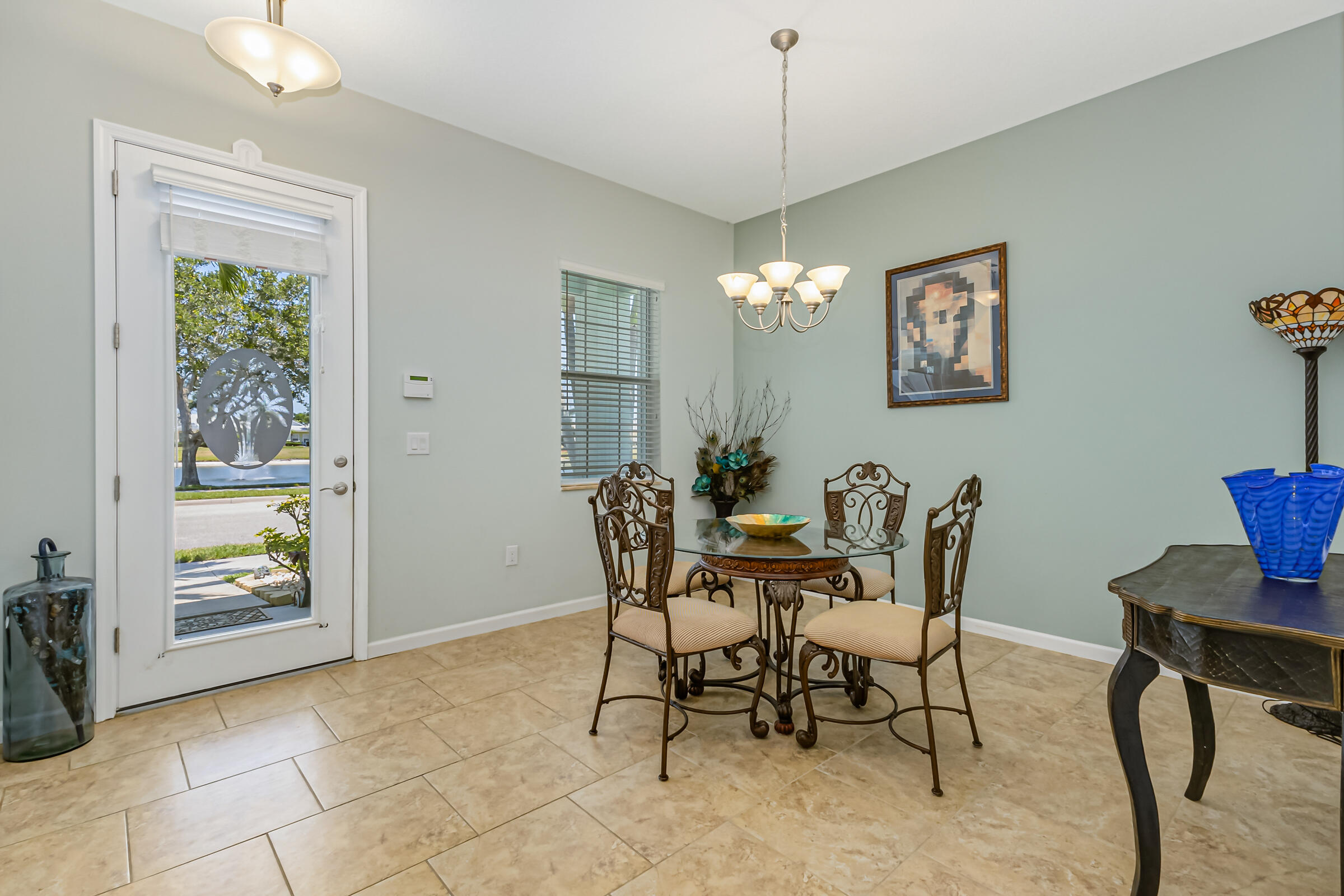 503 Heming Way Melbourne, FL 32901 - Photo 11 of 33 a view of a dining room with furniture and chandelier