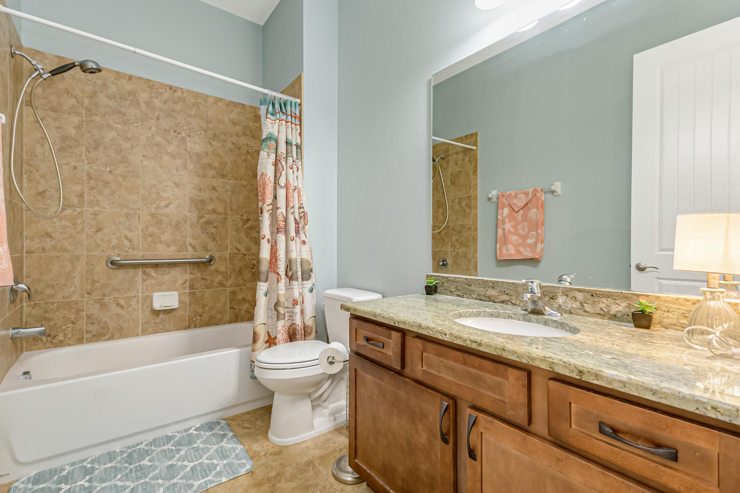 503 Heming Way Melbourne, FL 32901 - Photo 13 of 33 a bathroom with a granite countertop sink toilet and shower