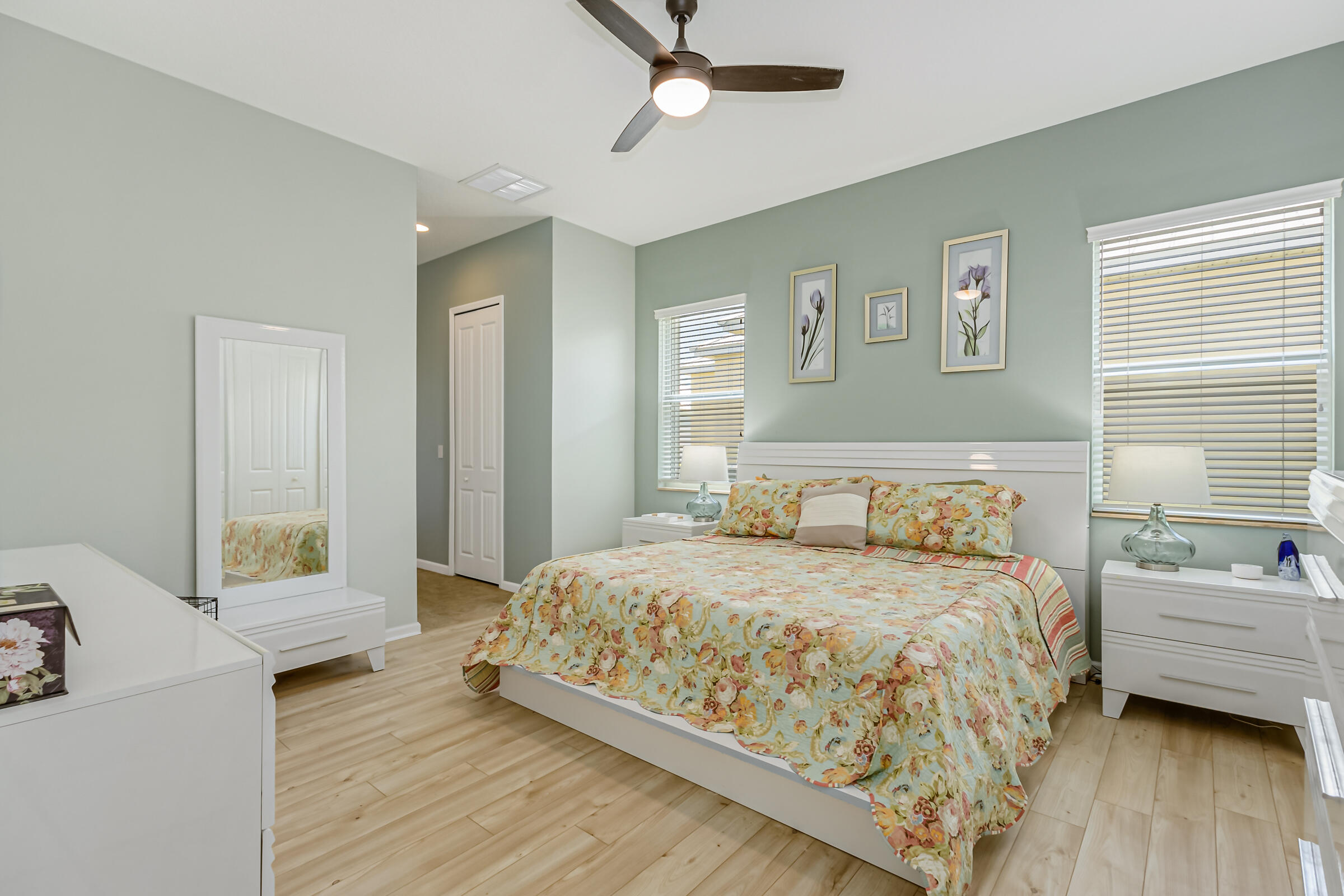 503 Heming Way Melbourne, FL 32901 - Photo 16 of 33 a bedroom with a bed and wooden floor