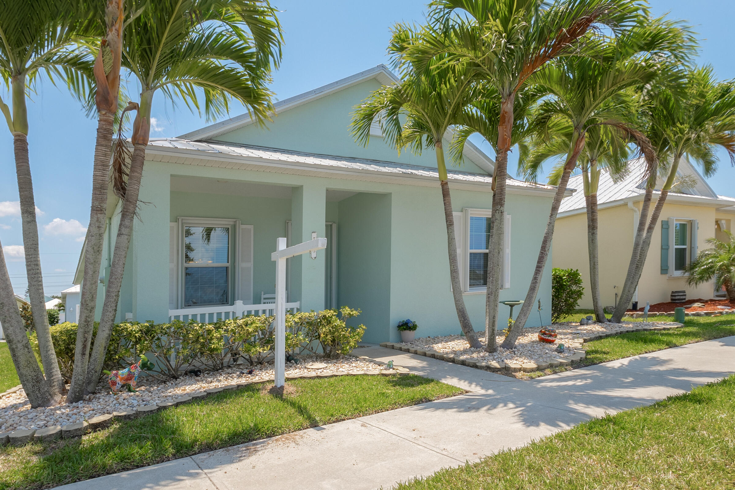 503 Heming Way Melbourne, FL 32901 - Photo 2 of 33 a front view of a house with a yard and potted plants