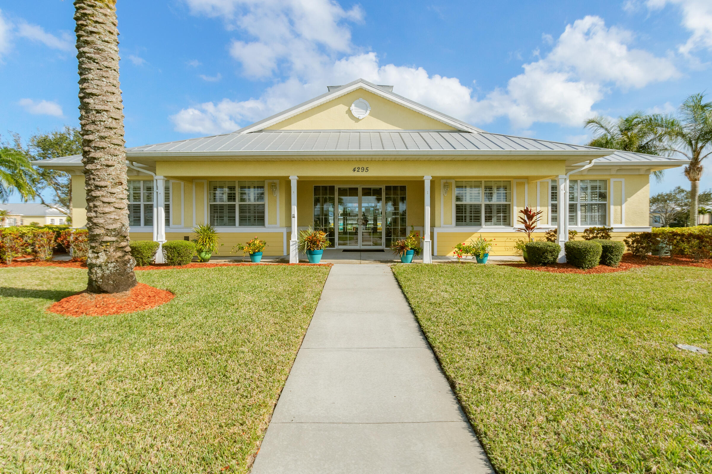 503 Heming Way Melbourne, FL 32901 - Photo 22 of 33 a view of a patio with couches chairs large with large trees