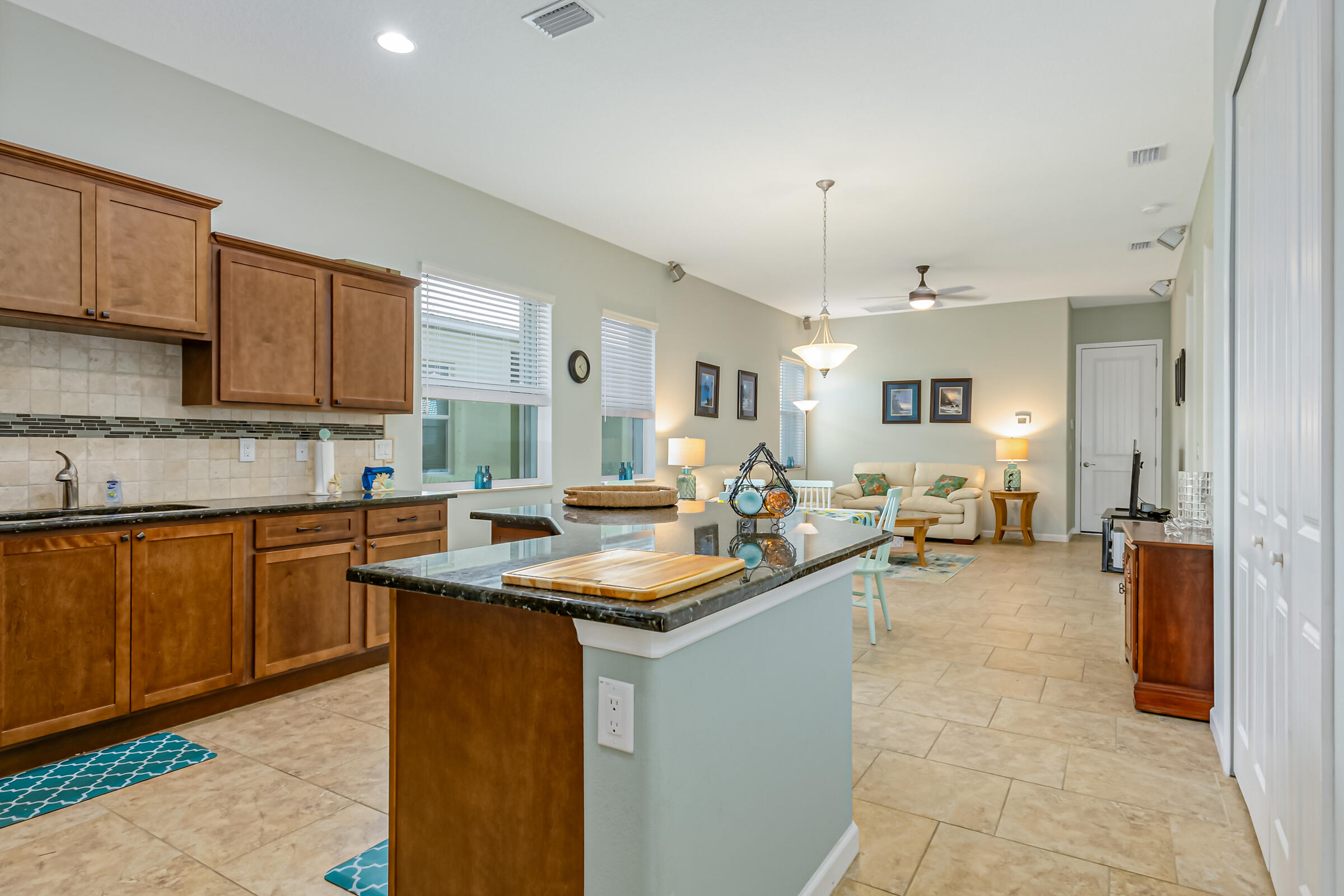 503 Heming Way Melbourne, FL 32901 - Photo 4 of 33 a kitchen with sink refrigerator and cabinets