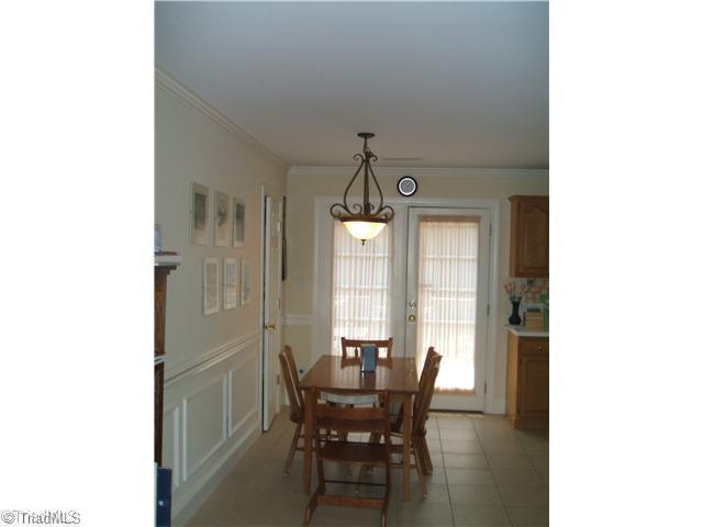 344 Clay Flynt Road Kernersville, NC 27284 - Photo 9 of 15 Dining Room. Leads from living room to deck by way of kitchen.