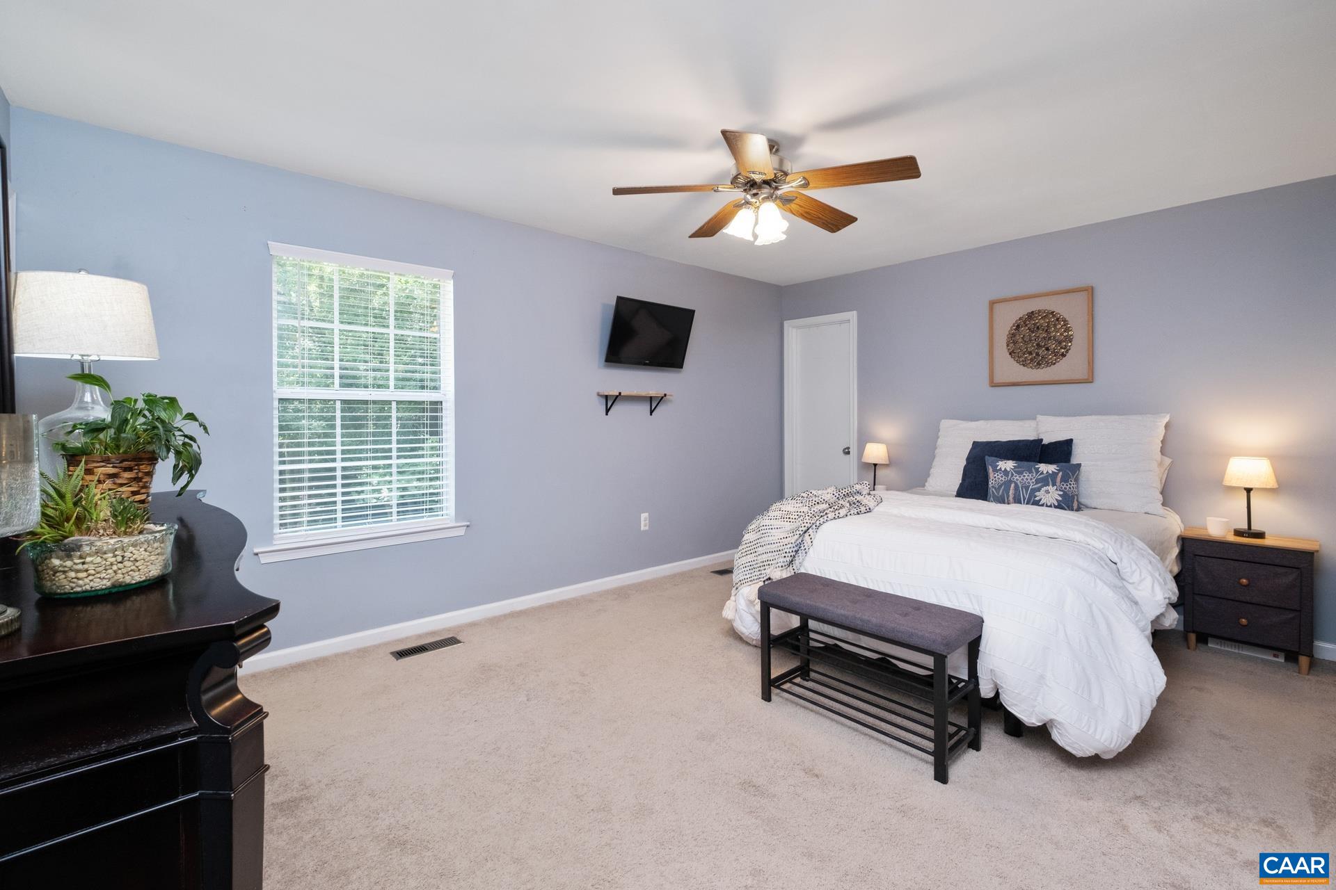 793 Geranium Road Ruckersville, VA 22968 - Photo 11 of 31 a spacious bedroom with a bed and a window