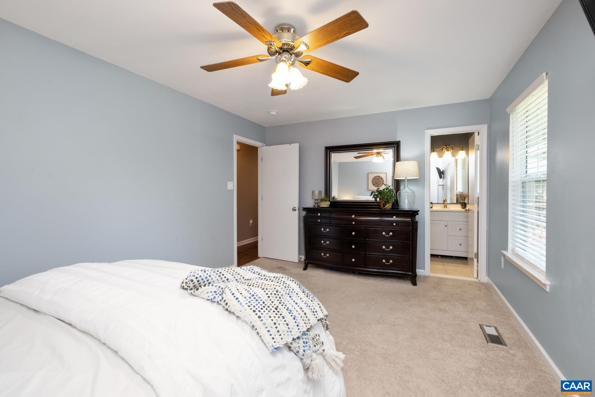 793 Geranium Road Ruckersville, VA 22968 - Photo 12 of 31 a bedroom with a bed and a dresser