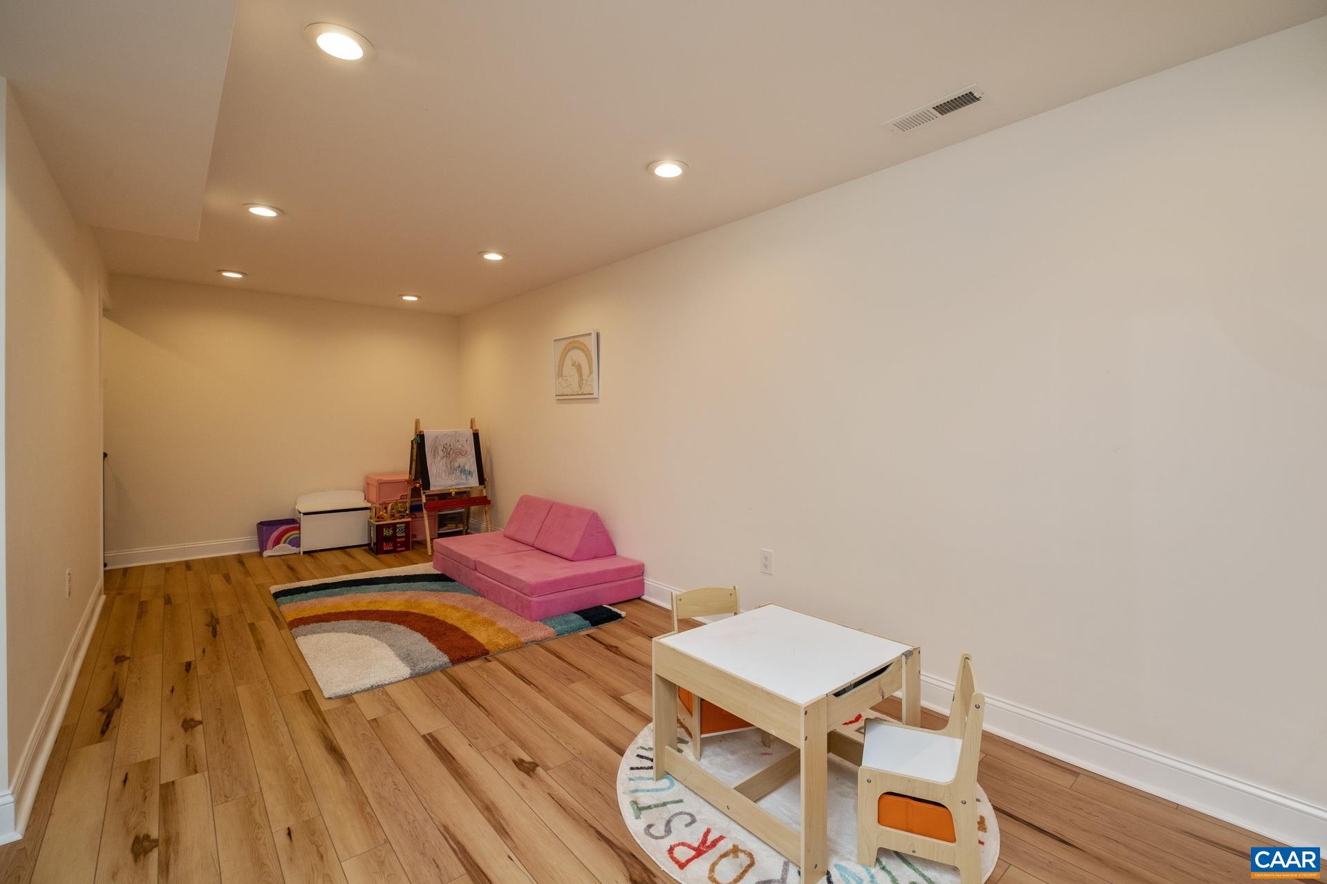 793 Geranium Road Ruckersville, VA 22968 - Photo 20 of 31 a bed room with a bed and a wooden floor