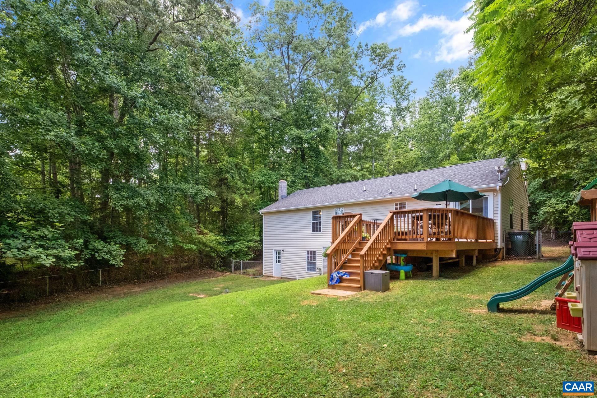 793 Geranium Road Ruckersville, VA 22968 - Photo 23 of 31 an aerial view of a house with garden space and deck