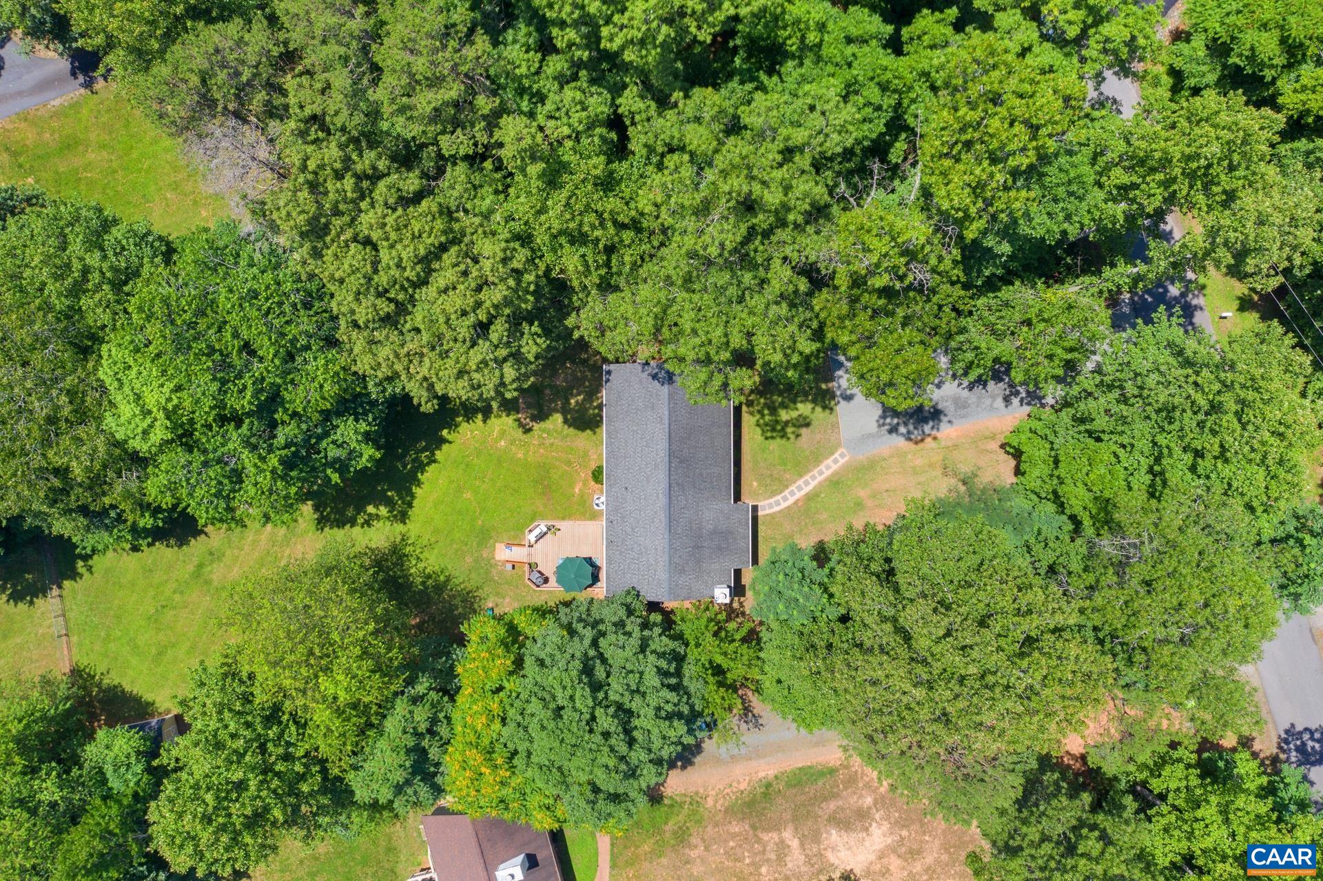 793 Geranium Road Ruckersville, VA 22968 - Photo 29 of 31 a view of a garden with a fountain