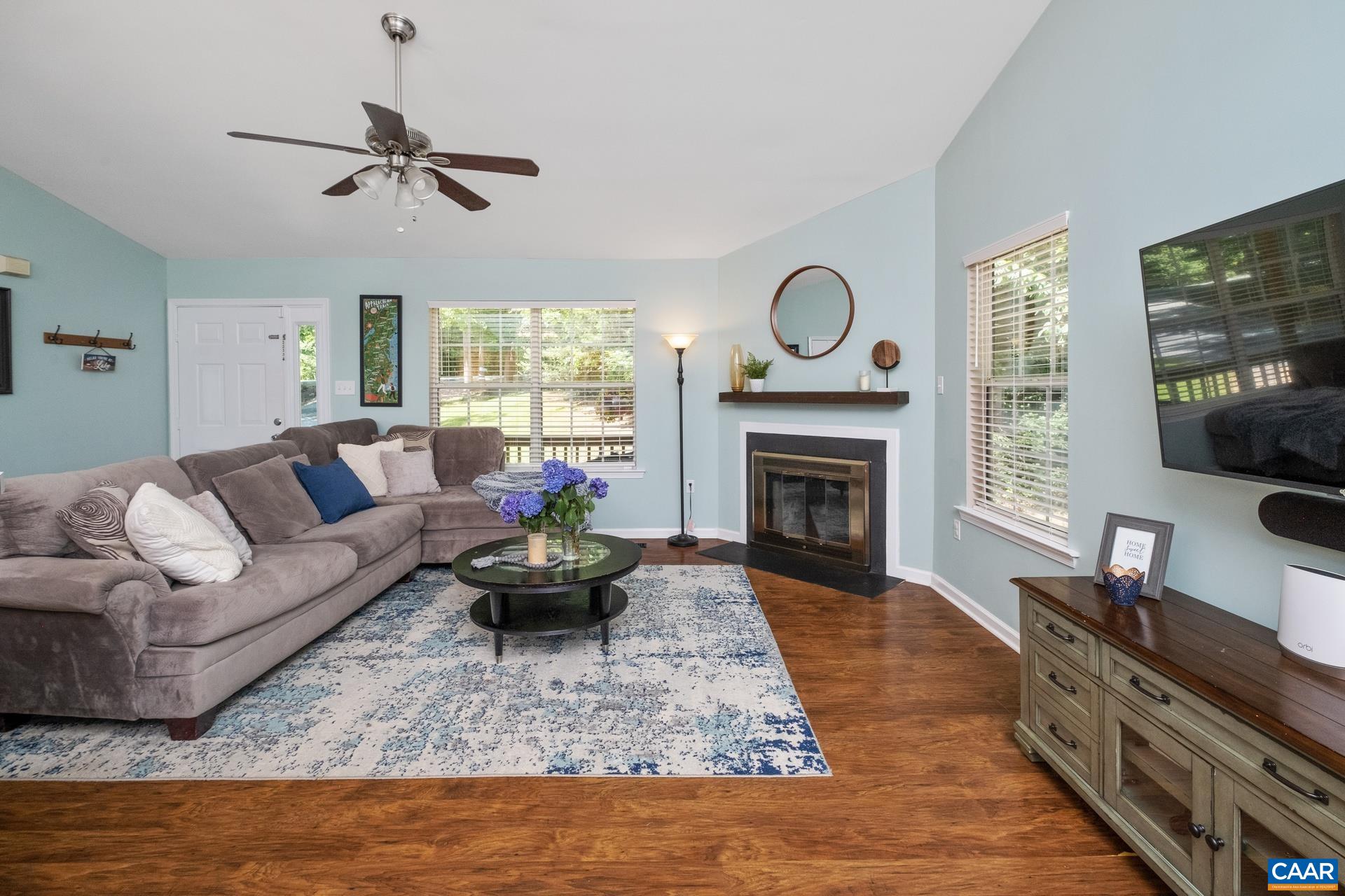 793 Geranium Road Ruckersville, VA 22968 - Photo 4 of 31 a living room with furniture fireplace and flat screen tv