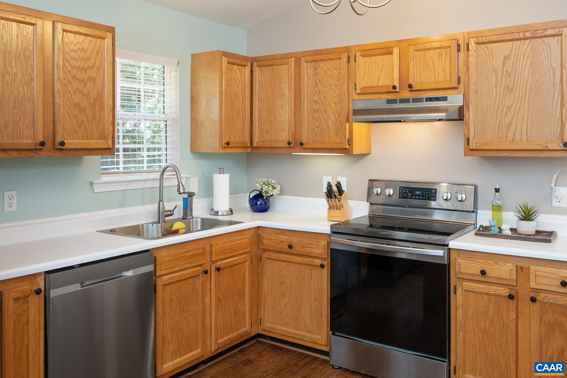 793 Geranium Road Ruckersville, VA 22968 - Photo 9 of 31 a kitchen with stainless steel appliances granite countertop a sink and a stove