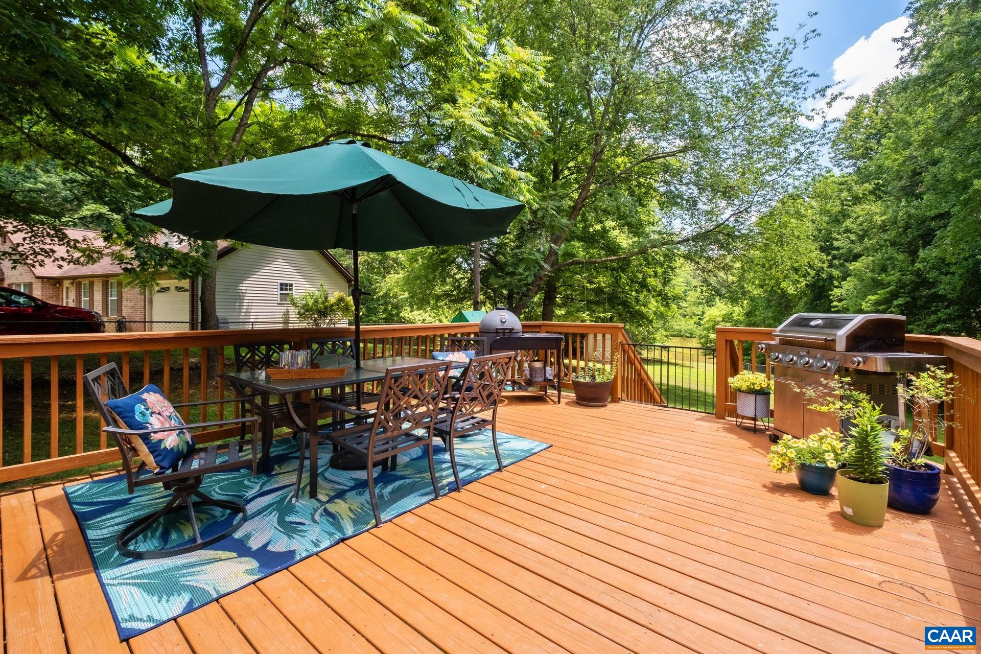 793 Geranium Road Ruckersville, VA 22968 - Photo 10 of 31 a view of a chairs and tables on the wooden deck