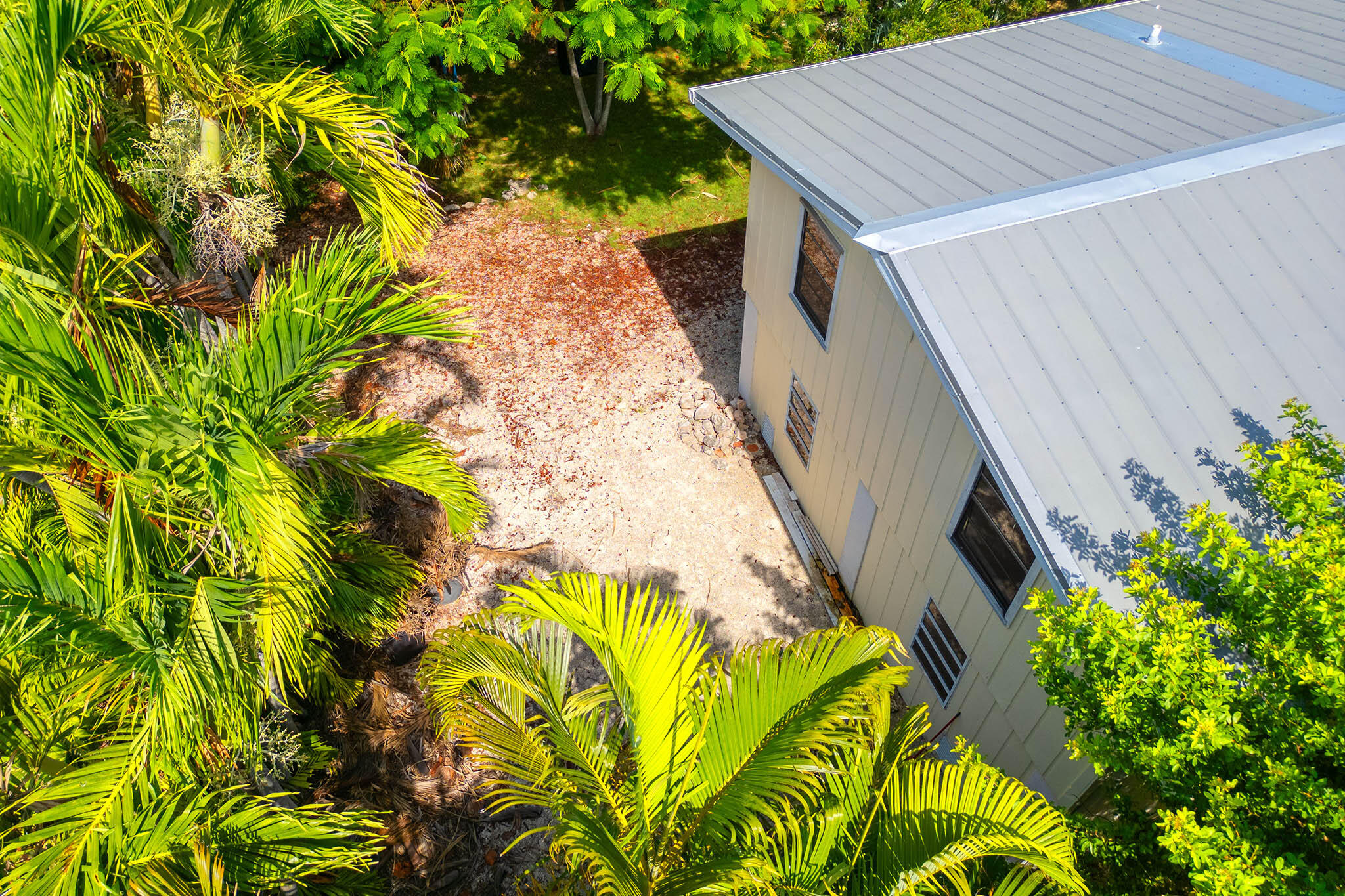 29951 Pine Channel Road Big Pine Key, FL 33043 - Photo 11 of 61 a aerial view of a house with swimming pool in a backyard