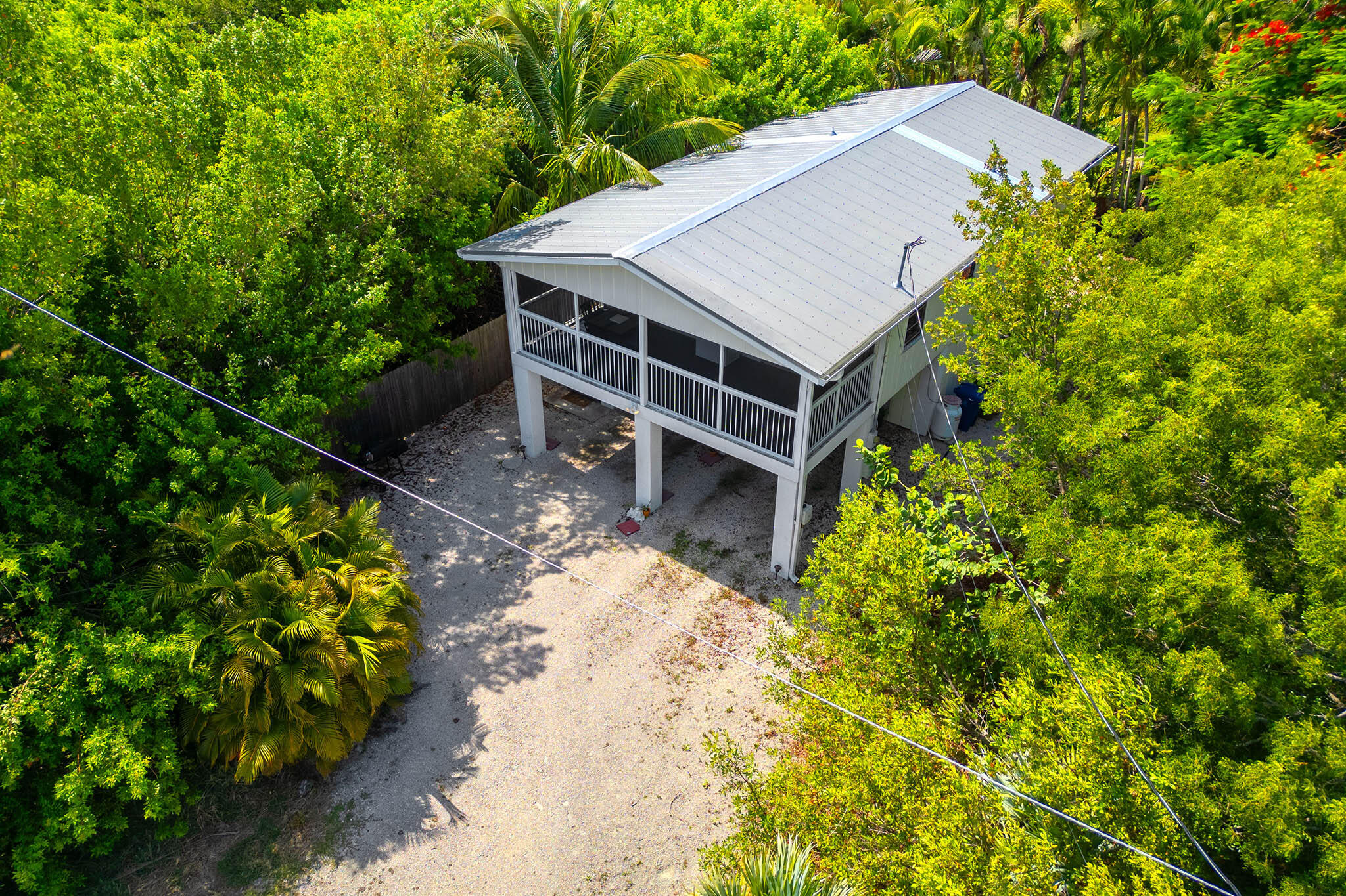 29951 Pine Channel Road Big Pine Key, FL 33043 - Photo 12 of 61 a house with trees in front of it