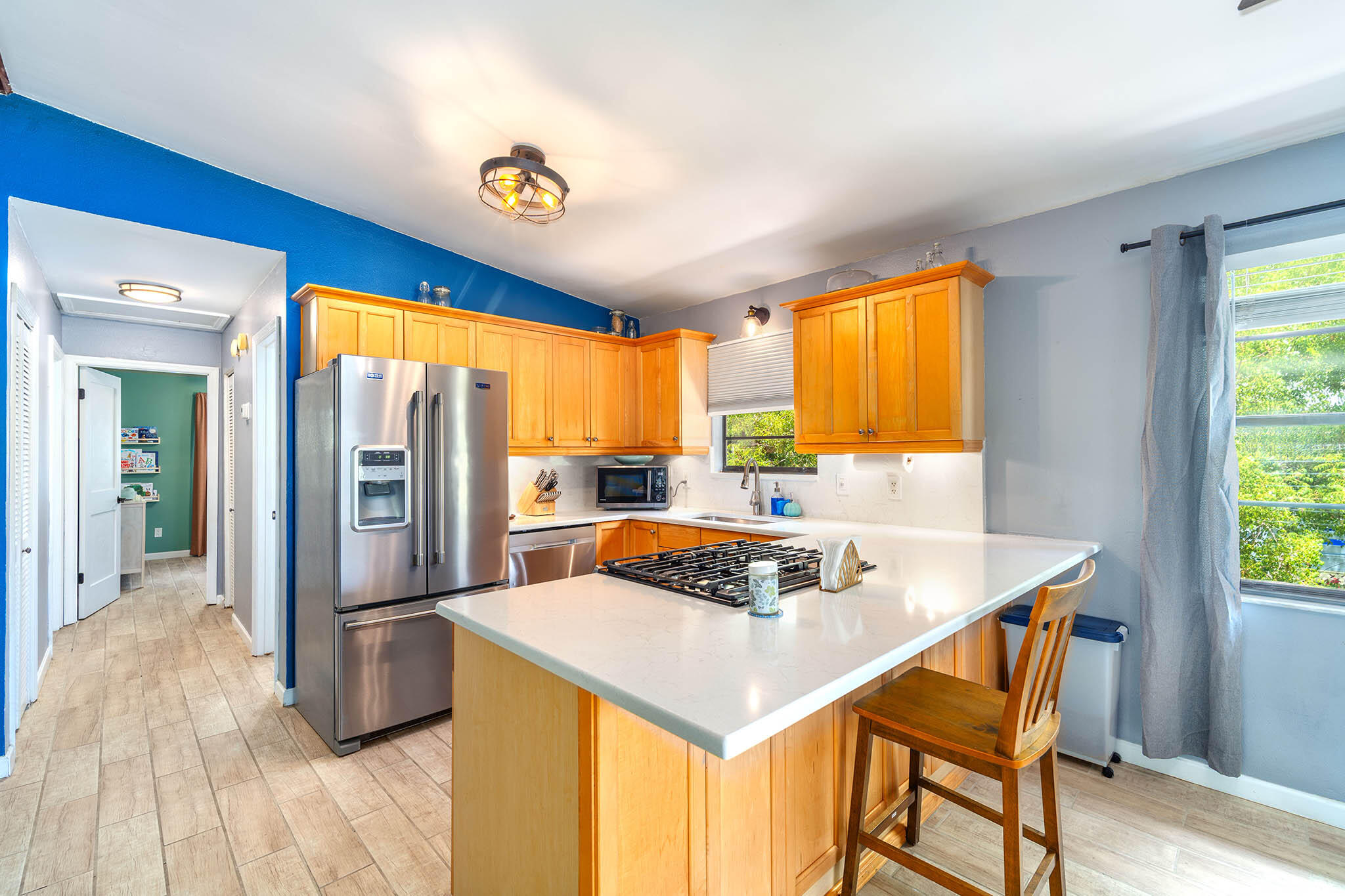 29951 Pine Channel Road Big Pine Key, FL 33043 - Photo 24 of 61 a kitchen with stainless steel appliances granite countertop a sink a stove and a refrigerator