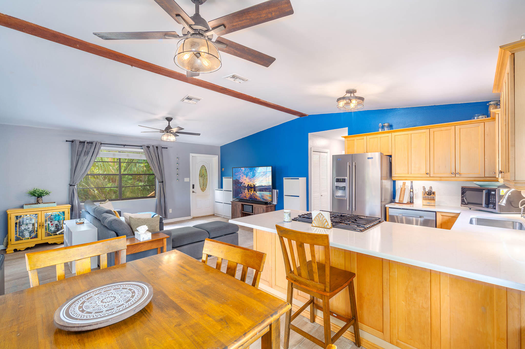 29951 Pine Channel Road Big Pine Key, FL 33043 - Photo 26 of 61 a living room with dining table furniture kitchen view and a large window