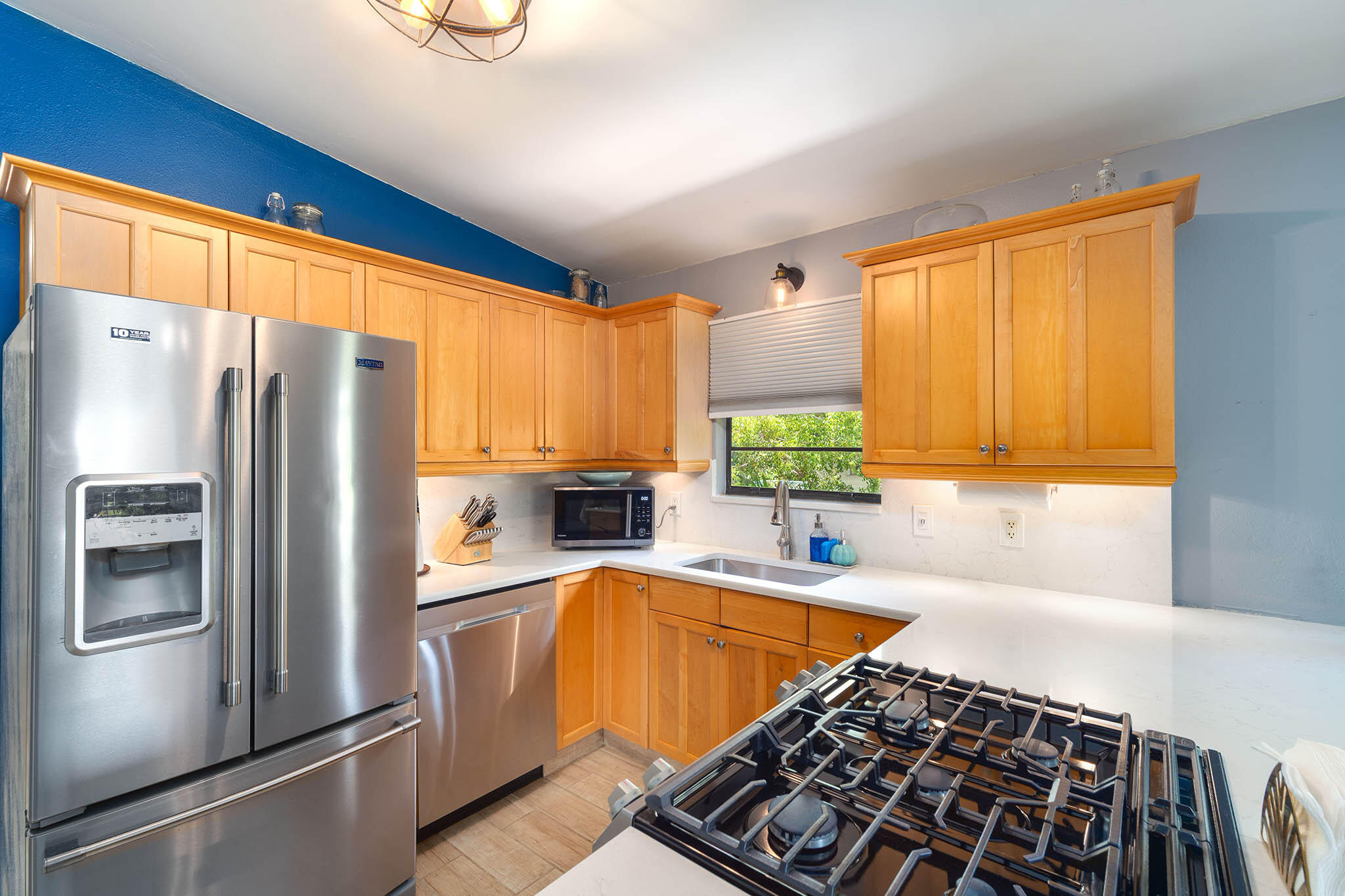 29951 Pine Channel Road Big Pine Key, FL 33043 - Photo 28 of 61 a kitchen with stainless steel appliances a refrigerator sink and cabinets