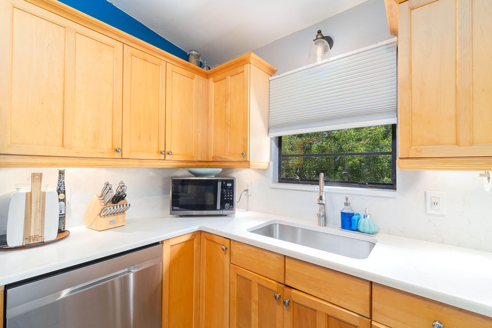 29951 Pine Channel Road Big Pine Key, FL 33043 - Photo 30 of 61 a kitchen with stainless steel appliances a sink a refrigerator and window