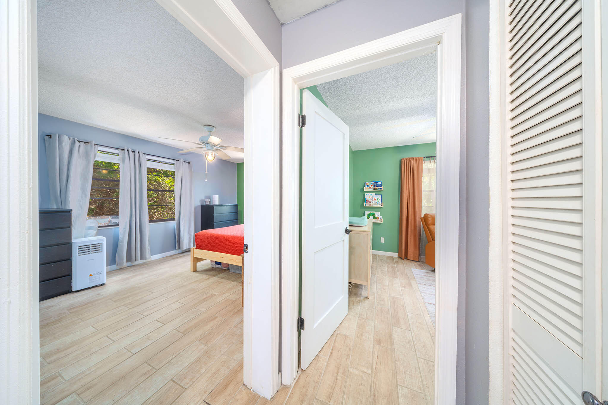 29951 Pine Channel Road Big Pine Key, FL 33043 - Photo 35 of 61 a view of a hallway with wooden floor and windows