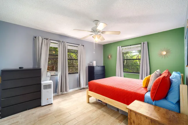 a view of a chairs and table in balcony