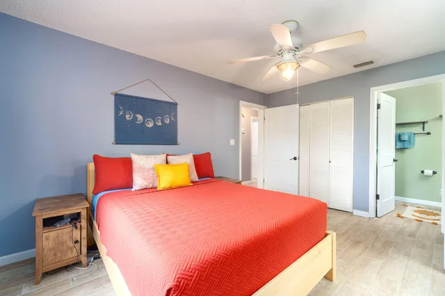 a view of a chair and tables in the balcony