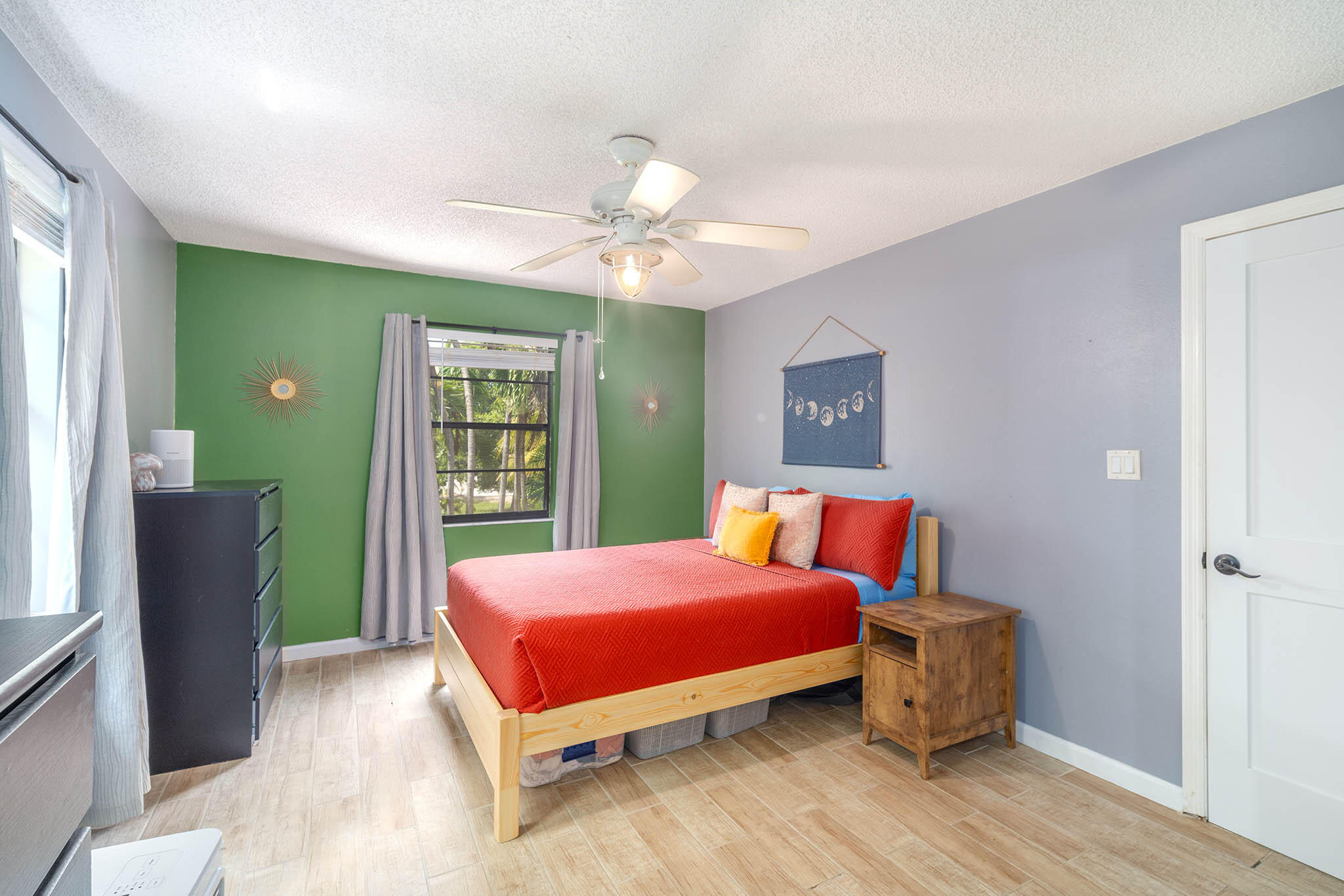 29951 Pine Channel Road Big Pine Key, FL 33043 - Photo 40 of 61 a bedroom with a bed and a chandelier