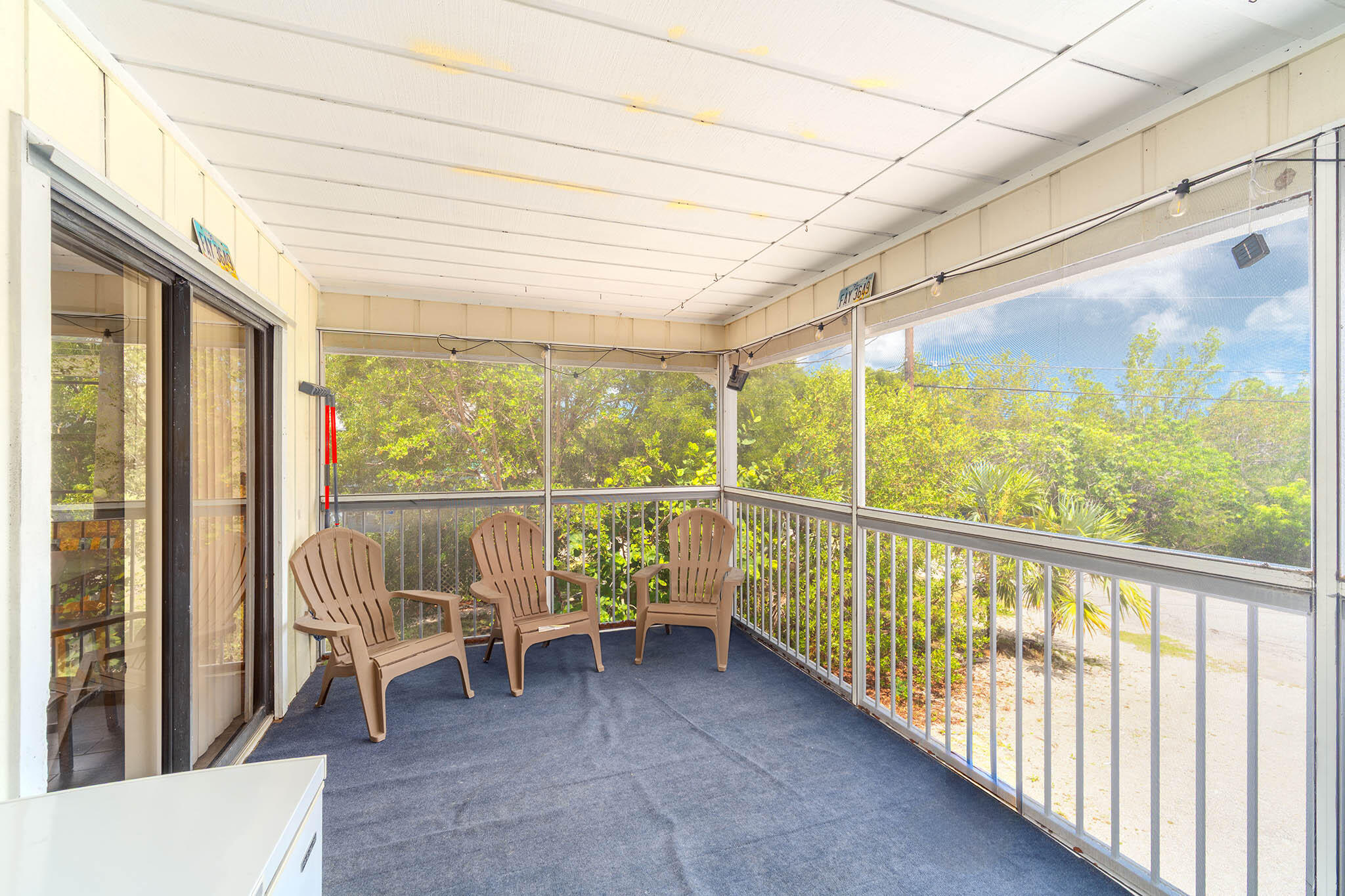29951 Pine Channel Road Big Pine Key, FL 33043 - Photo 44 of 61 a view of a chairs and table in balcony