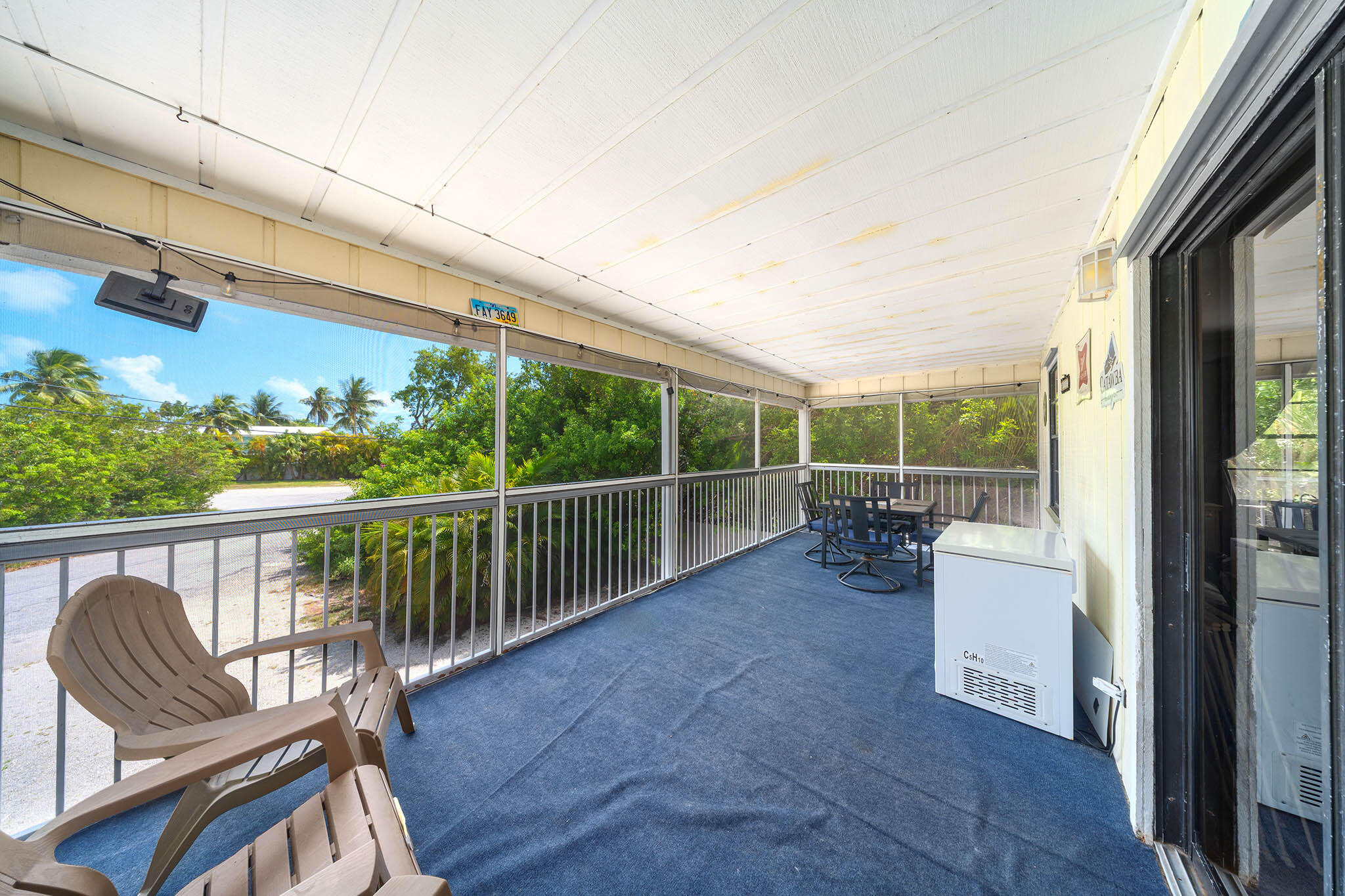 29951 Pine Channel Road Big Pine Key, FL 33043 - Photo 46 of 61 a view of a chair and tables in the balcony
