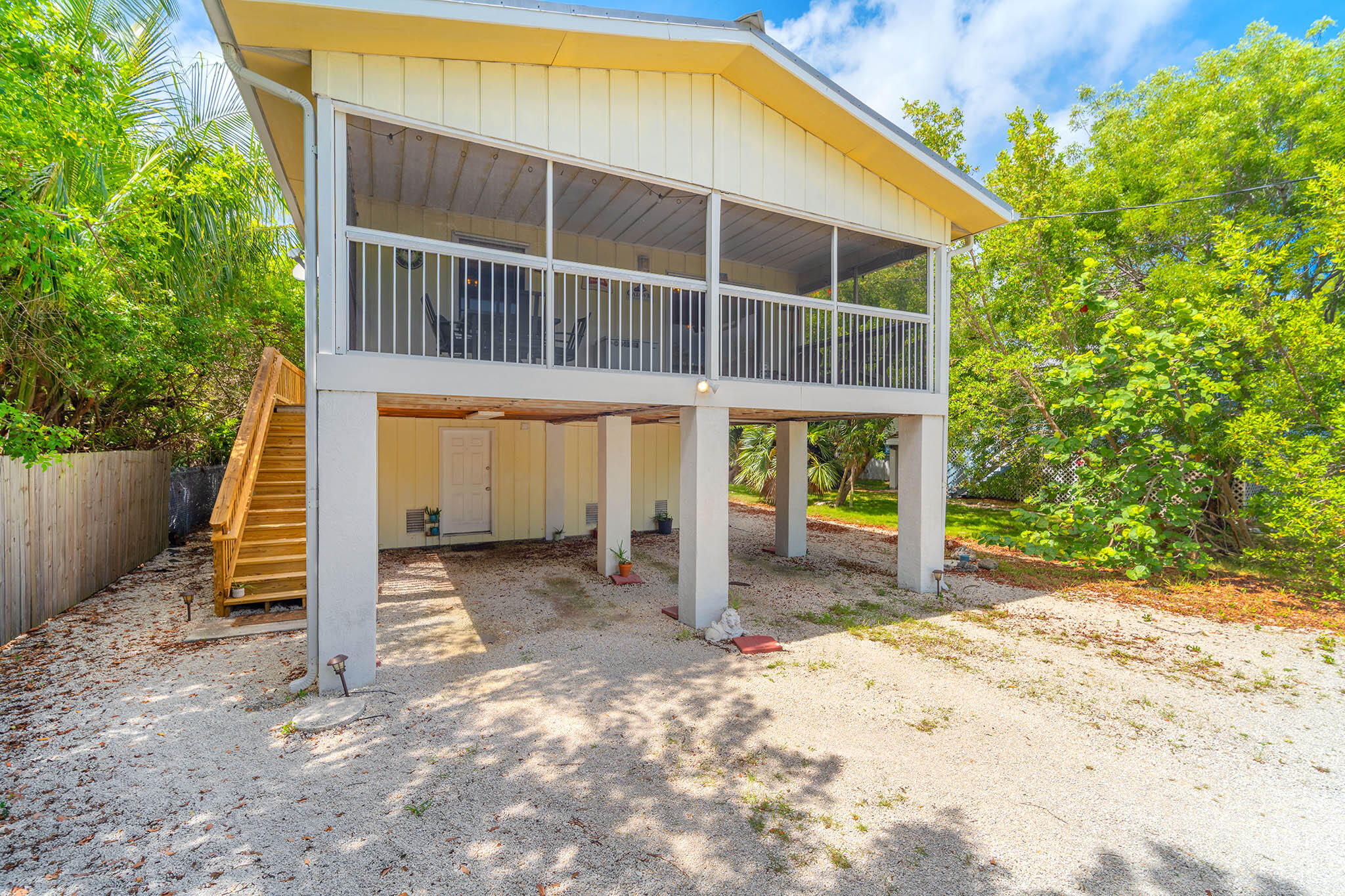 29951 Pine Channel Road Big Pine Key, FL 33043 - Photo 49 of 61 a view of a house with a yard and wooden fence