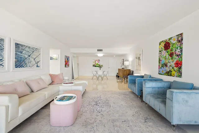 a bathroom with a granite countertop sink a toilet a mirror and shower