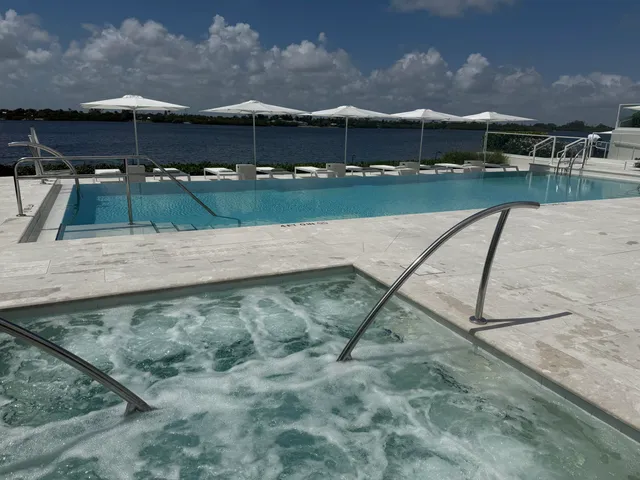 a view of a pathway with a garden