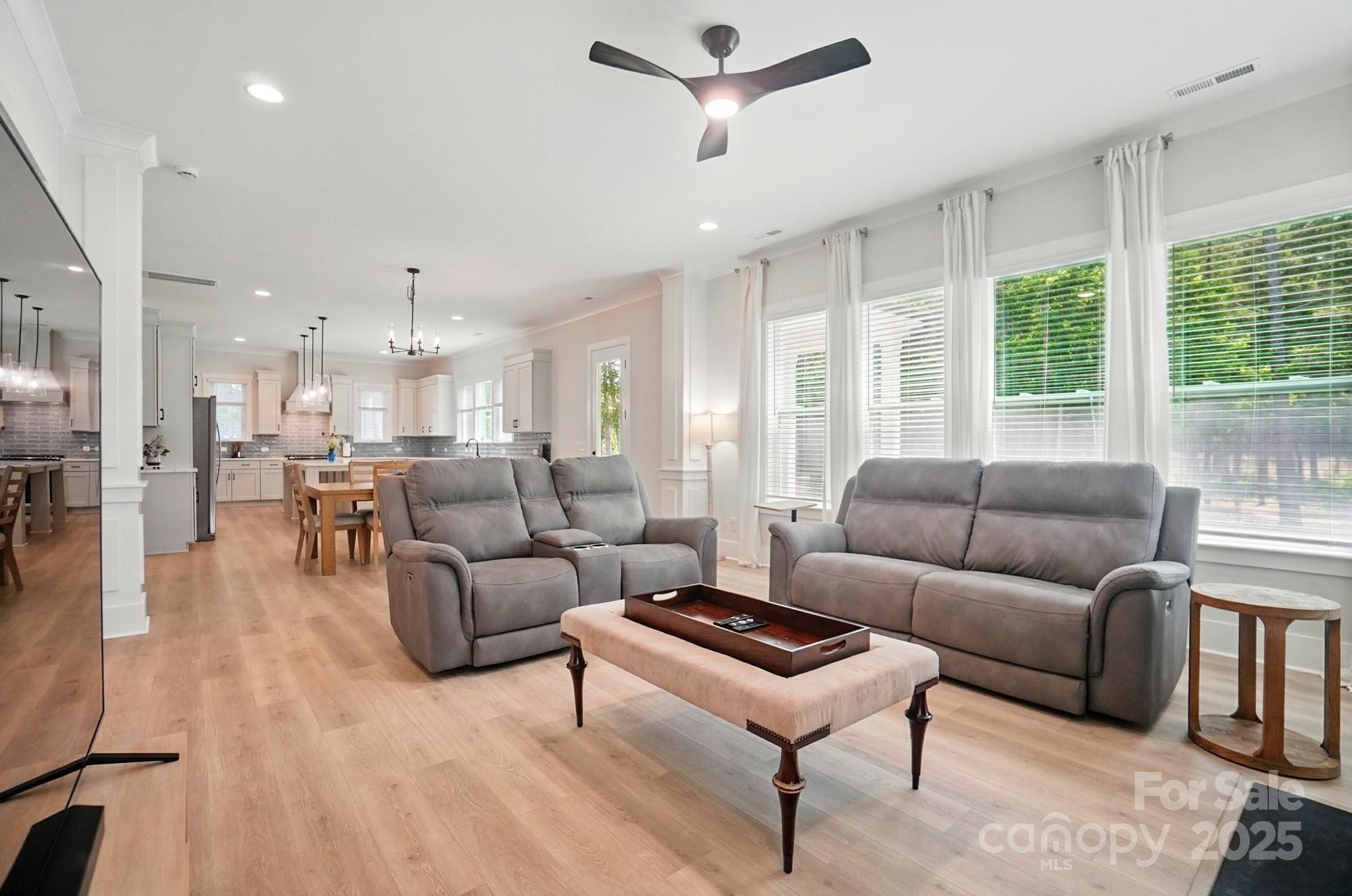 7818 Russell Road Indian Trail, NC 28079 - Photo 18 of 42 a living room with furniture and a large window