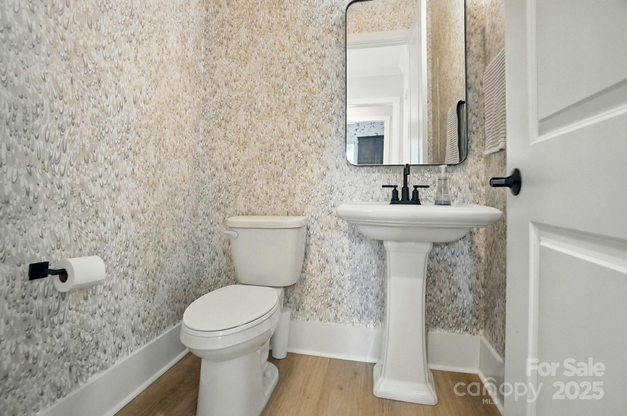 7818 Russell Road Indian Trail, NC 28079 - Photo 21 of 42 a bathroom with a sink and a toilet