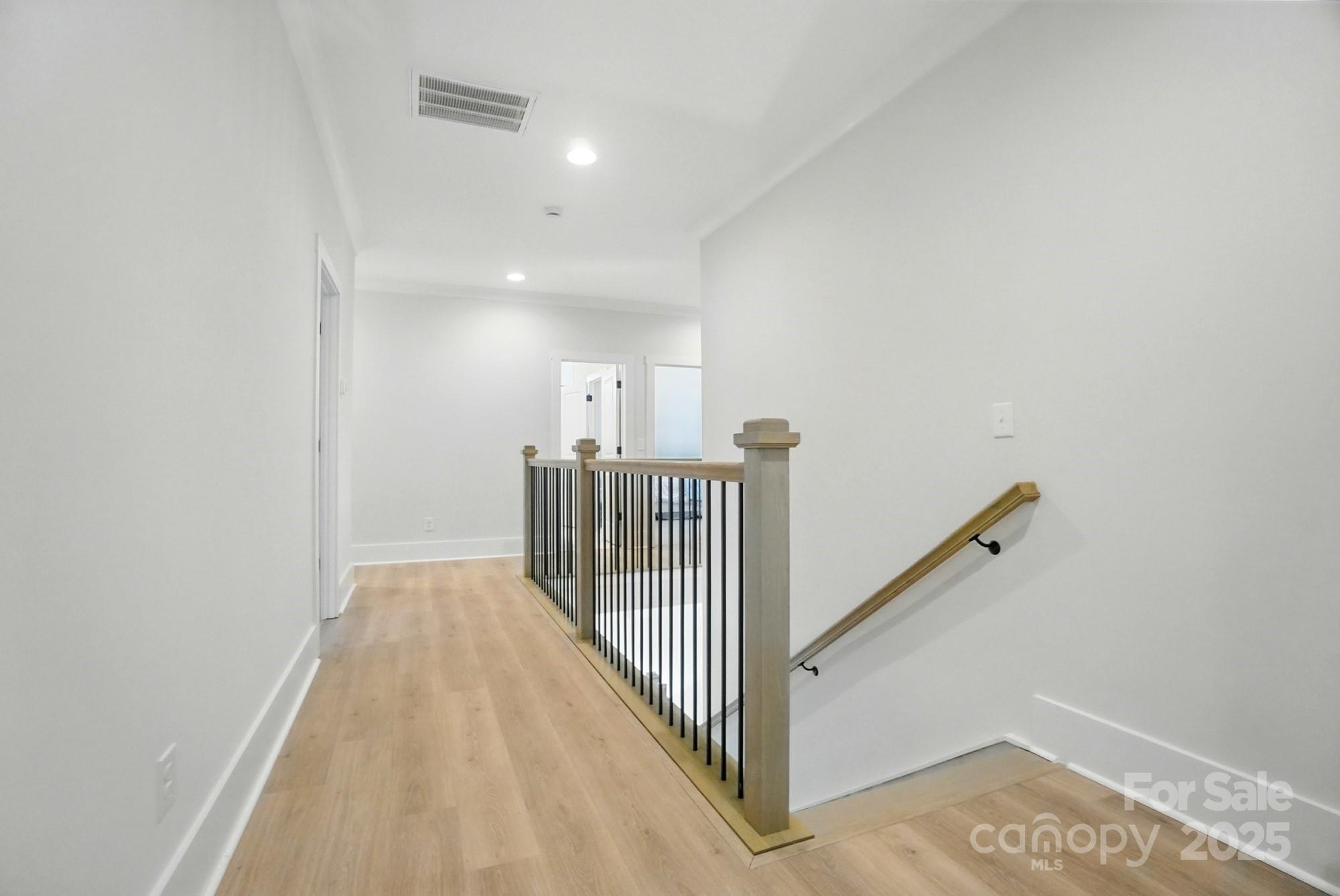 7818 Russell Road Indian Trail, NC 28079 - Photo 22 of 42 a view of a hallway with stairs