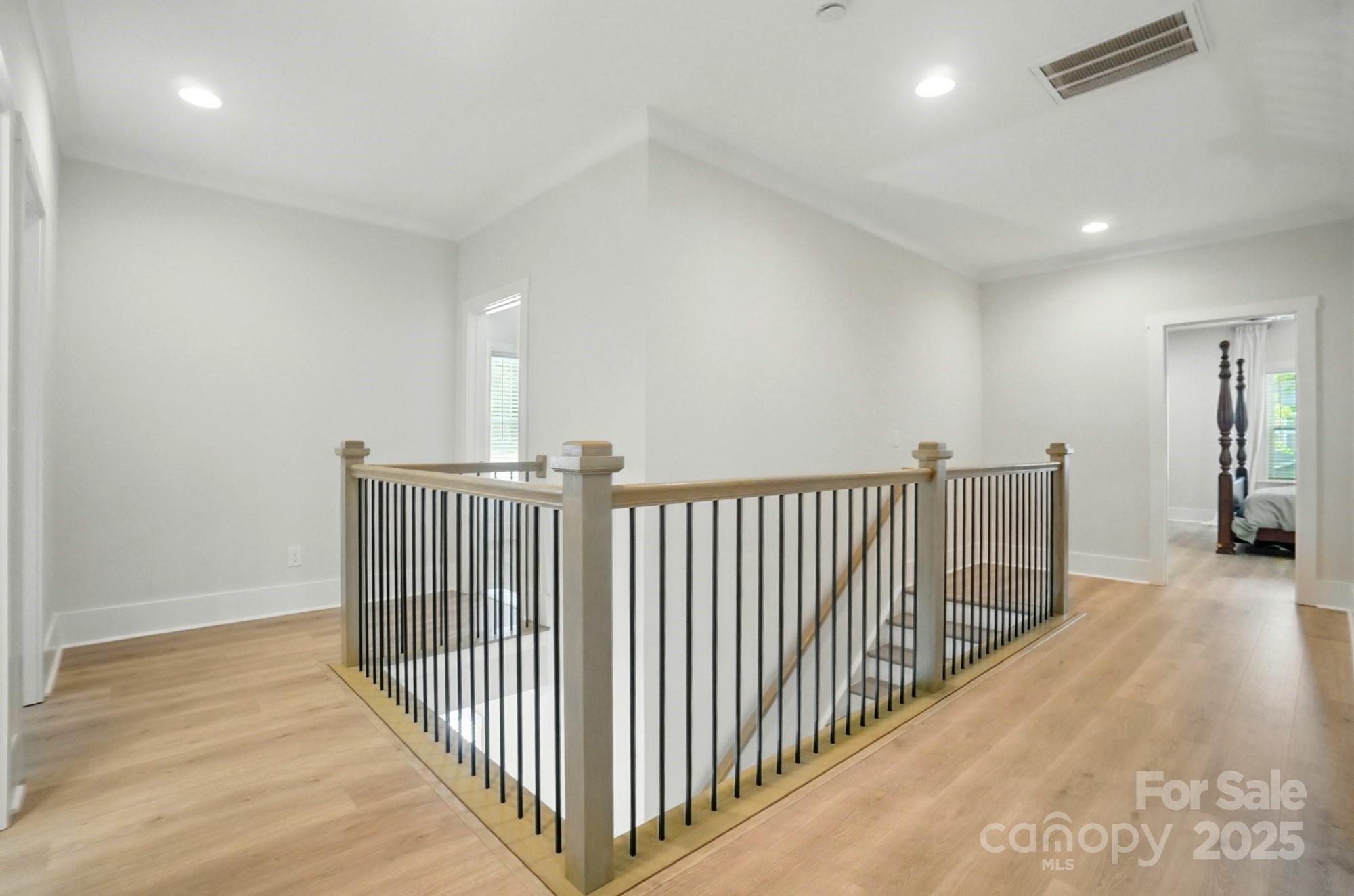 7818 Russell Road Indian Trail, NC 28079 - Photo 28 of 42 a view of a hallway with wooden floor