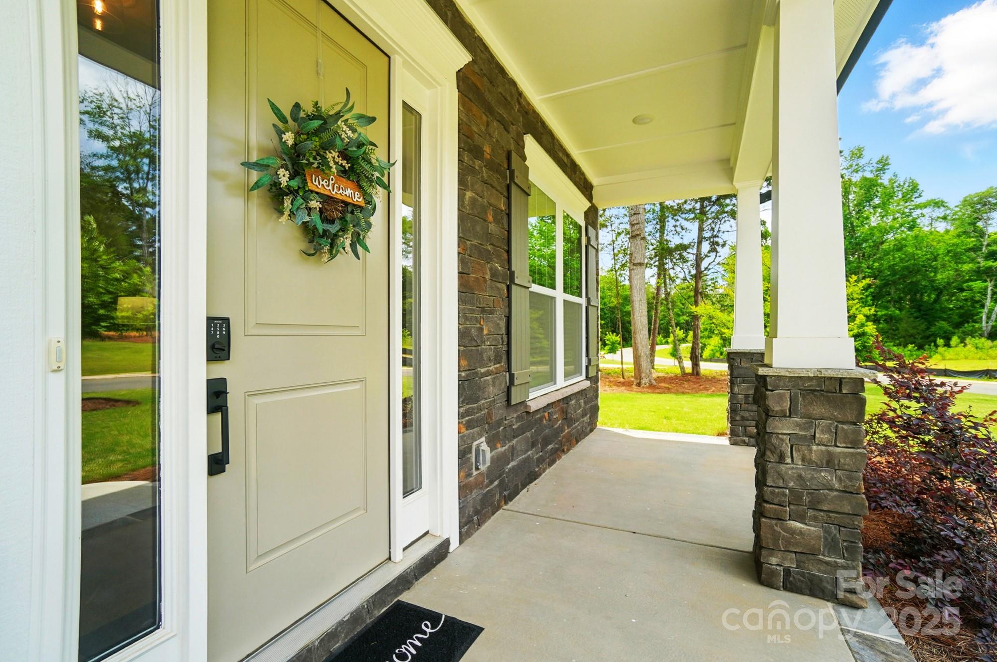 7818 Russell Road Indian Trail, NC 28079 - Photo 3 of 42 a view of porch with a door and wooden floor
